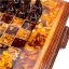 Резные шахматы в дубовом ларце, декорированные натуральным янтарем